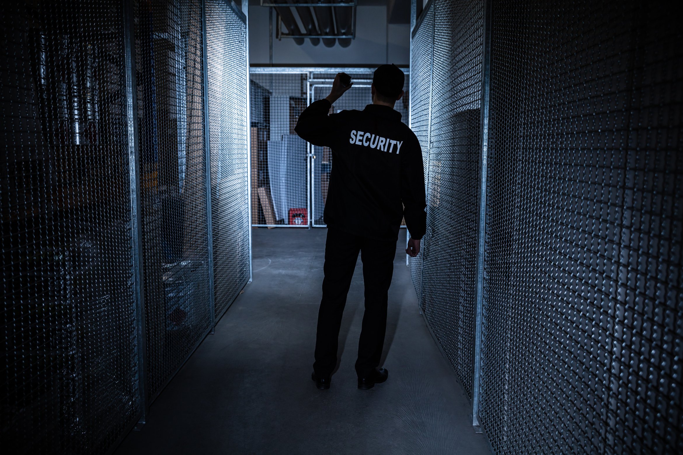 Security Guard Standing In The Warehouse